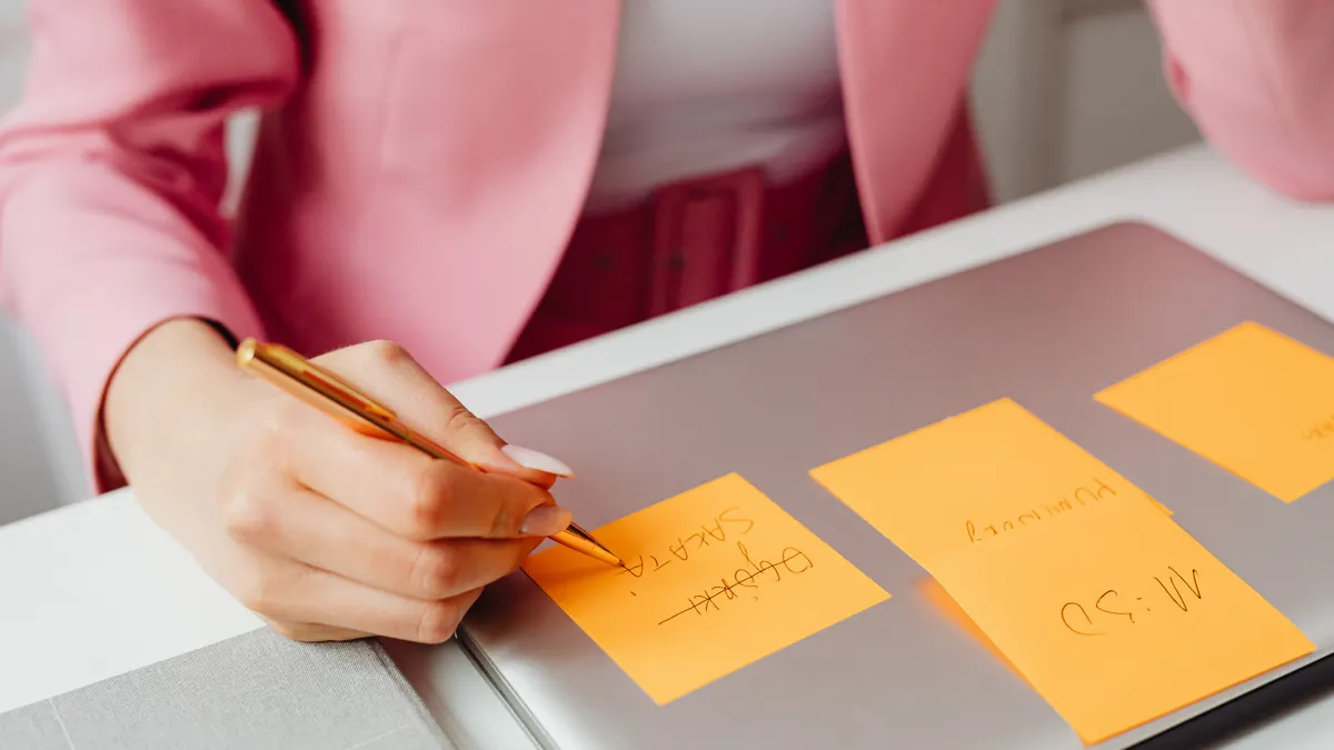 How to automate repetitive writing tasks with templates and variables — A Person Writing on the Sticky Note