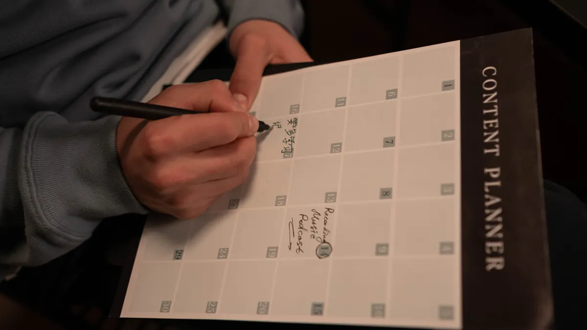 How to organize prompts for different content stages — A Hand Writing on a Planner