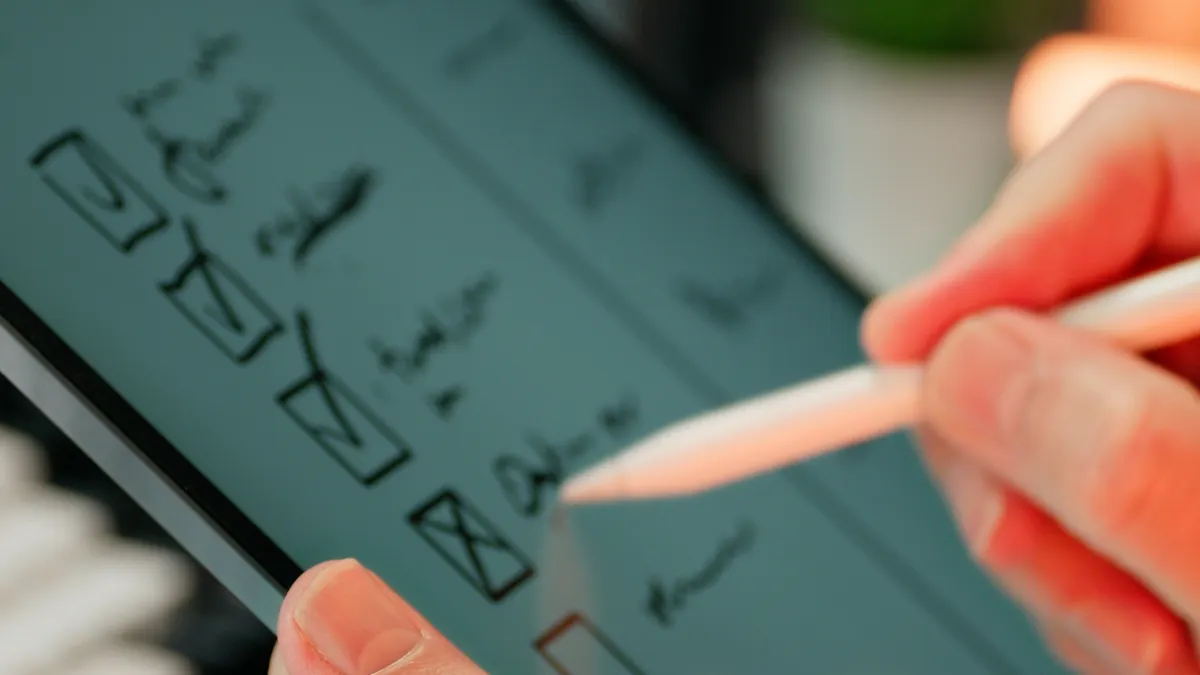 Review checklist for writing automation tools before you buy — Hands Writing on Digital Checklist with Stylus